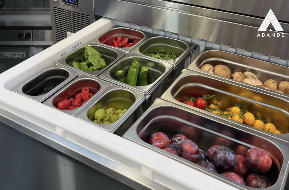 Opened Adande refrigerated drawer with GN pans inside